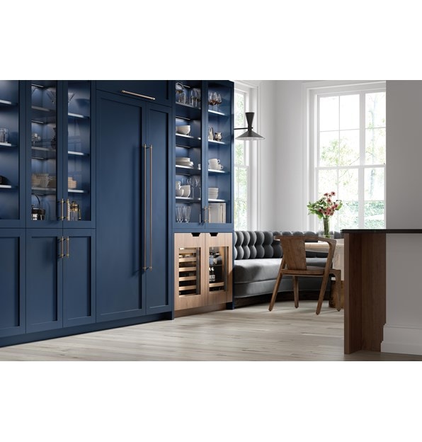Sub-Zero 24" Designer Undercounter ADA Height Beverage Center - Panel Ready (DEU2450BG/ADA) with contrasting custom light brown and navy blue cabinetry 