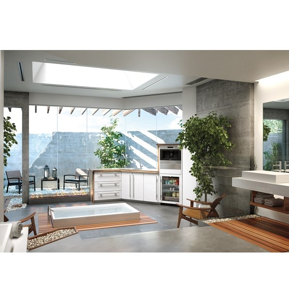 The Sub-Zero 24" Undercounter Beverage Center Panel Ready (UC- 24BG/O) displayed in the center of an open modish design.