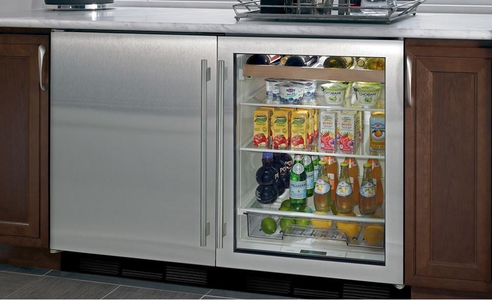 Sub-Zero 24&quot; Undercounter Beverage Center (UC-24BG/S) paired with 24&quot; Undercounter Wine Storage (424G/O) featuring stainless steel door
