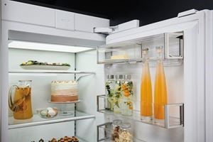Sub-Zero 30 in Designer Series flip-up dairy compartment shown preserving butter