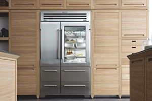 Sub-Zero Pro Series Stainless Steel Refrigerator displayed in kitchen with light wood cabinetry