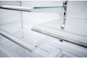 Close up view of Sub-Zero Classic Series Full Size Refrigerator's LED lit  custom shelves