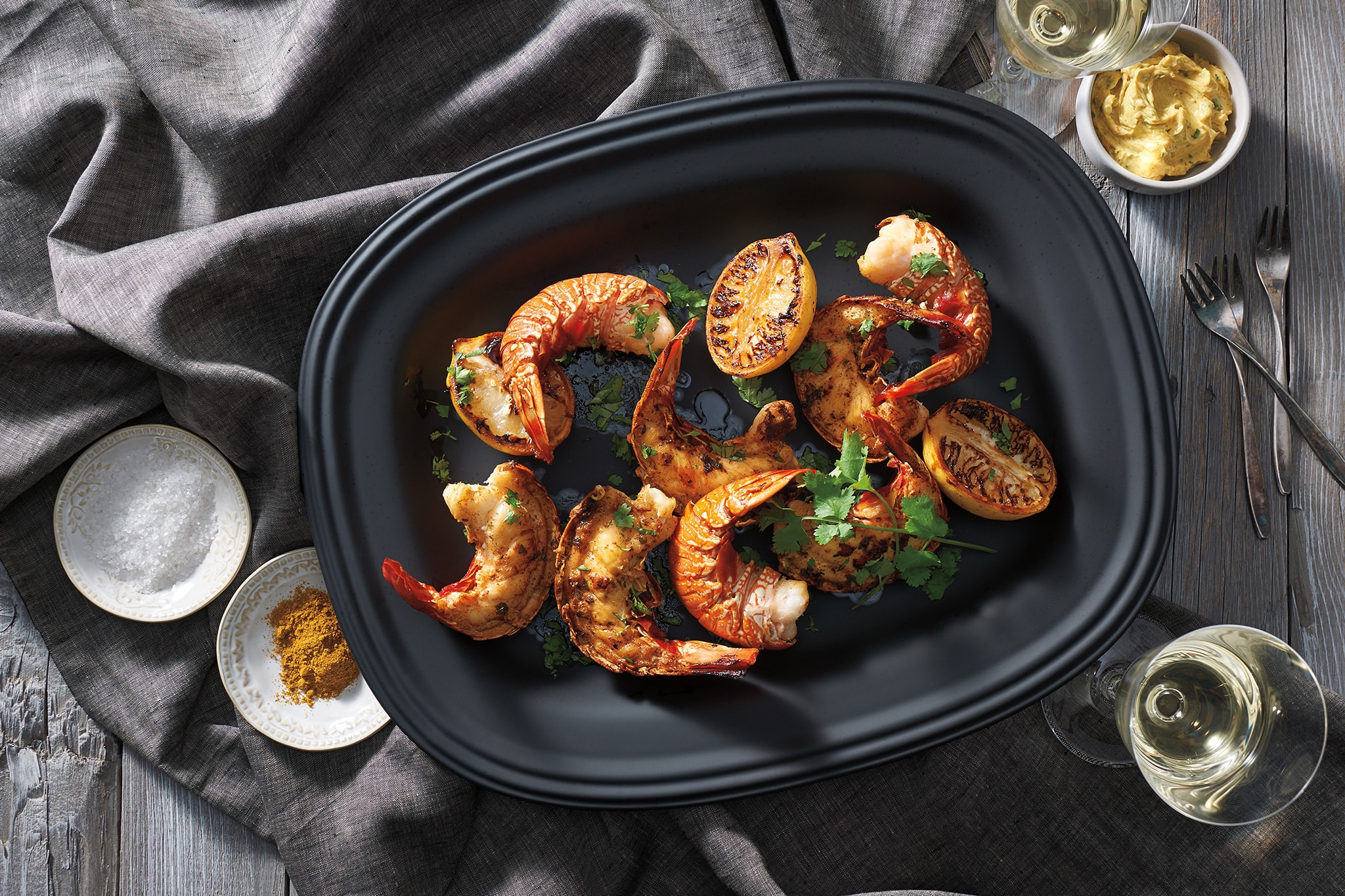 Grilled Lobster Tail with Curried Compound Butter and Grilled Lemons