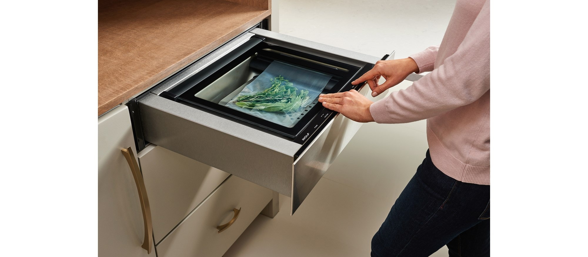 Wolf vacuum seal drawers remove air and seal foods or liquids for easy storage, marinating, and cooking.
