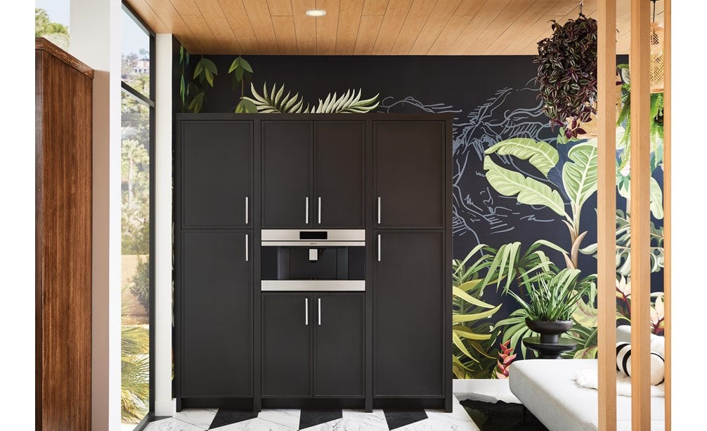 Wolf Built-In Coffee System shown installed seamlessly in black cabinetry