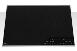 Top view of Wolf Electric Cooktop featuring smooth, black, seamless design.