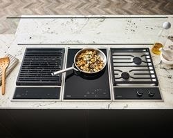 Wolf 15&quot; transitional grill module (GM15TFS) paired with a 15&quot; transitional induction cooktop module (CI152TFS) and 15&quot; transitional gas cooktop module (CG152TFS)