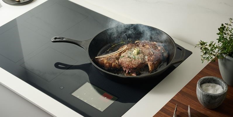 Searing steak on 30-inch Induction Cooktop in cast iron skillet