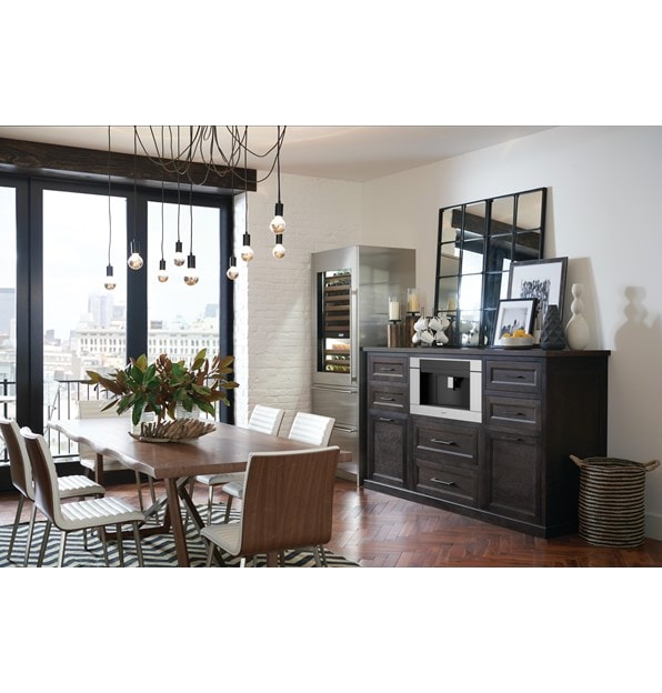 The Wolf 24" Coffee System Black Glass (EC24/B) shown set in a rustic pantry-style coffee station conveniently located in dining room