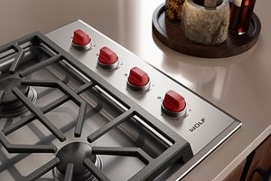 Wolf M Series 30" Gas Cooktop (Professional) shown with iconic red knobs