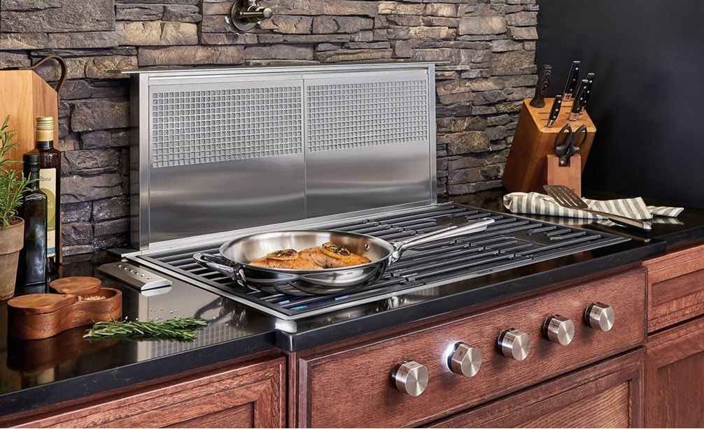 Wolf 36&quot; Contemporary Gas Cooktop 5 Burner (CG365C/S) shown in an array of rich textures including brick backsplash and dark cabinetry