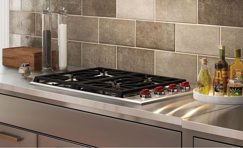 The Wolf 30&quot; Professional Gas Cooktop 4 Burner (CG304P/S) shown paired with Wolf 30&quot; Cooktop Wall Hood - Stainless (VW30S)