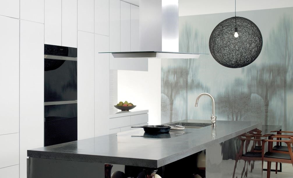 Wolf 30&quot; Contemporary Induction Cooktop (CI304C/B) featured in large open kitchen with sleek smooth eat in granite island