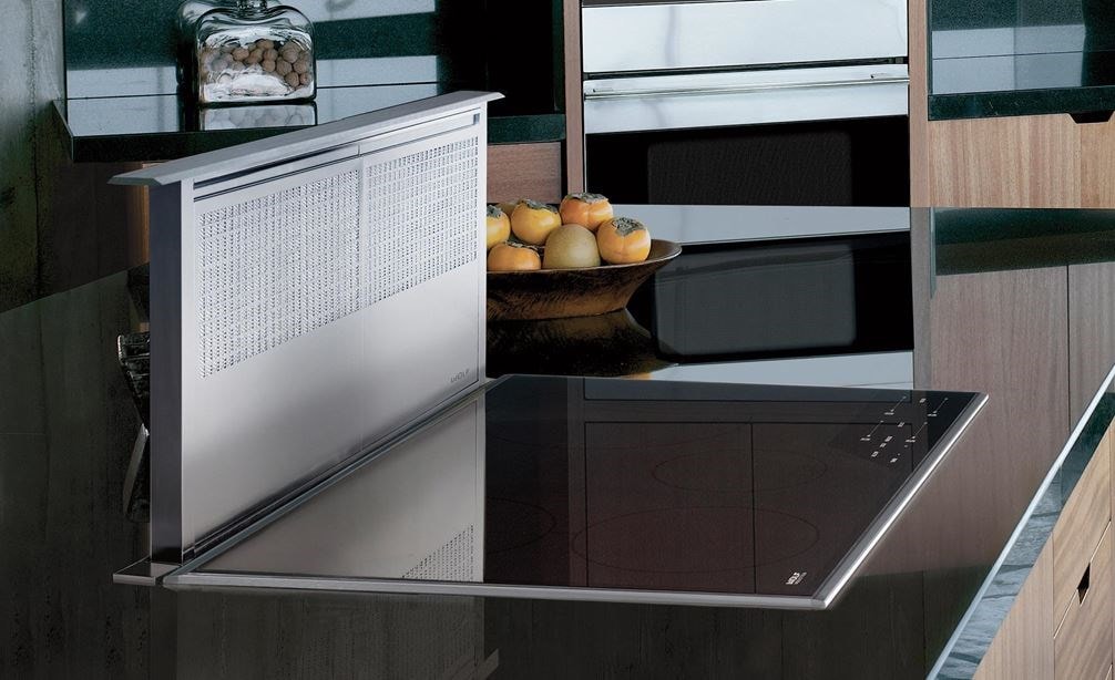 The Wolf 36&quot; Transitional Induction Cooktop (CI365T/S) shown with 36&quot; Downdraft Ventilation (DD36) in large smooth granite countertop