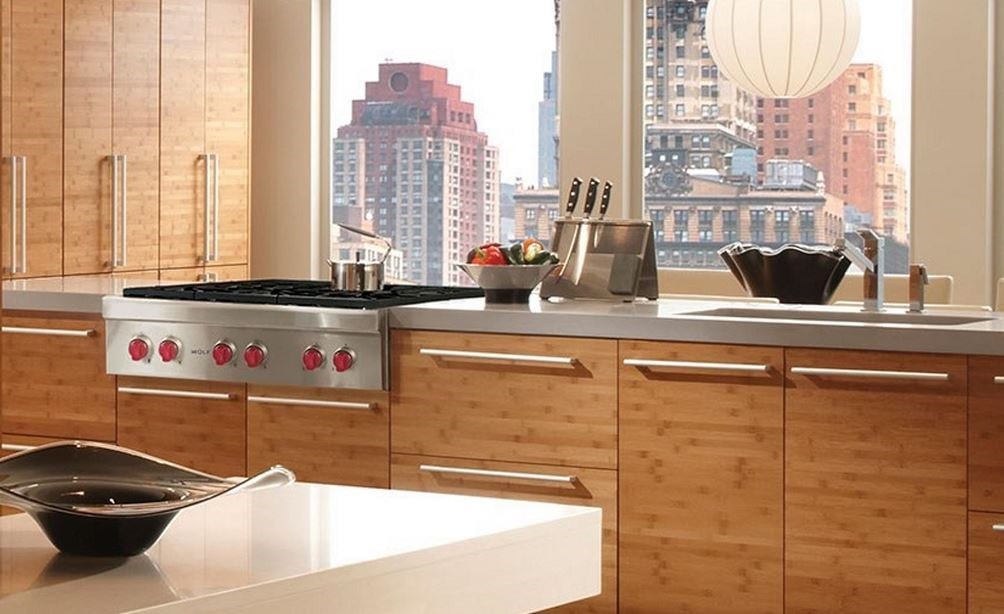 The Wolf 36&quot; Sealed 6 Burner Rangetop (SRT366) shown in a large contemporary l-shaped kitchen with flat-panel cabinets