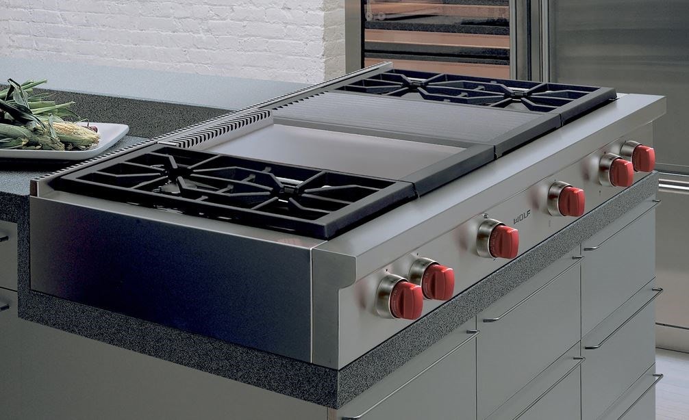 The Wolf 48&quot; Sealed 4 Burner Rangetop Infrared Charbroiler and Griddle (SRT484CG) fits superbly into custom granite countertops. 