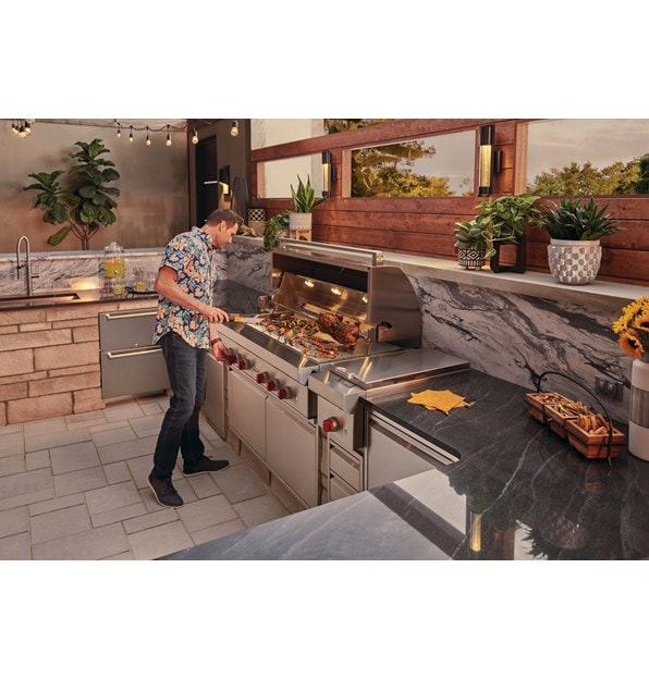 The Wolf 54" Outdoor Gas Grill (OG54) paired with Wolf 13" Classic Burner Module (BM13) for total outdoor kitchen versatility.