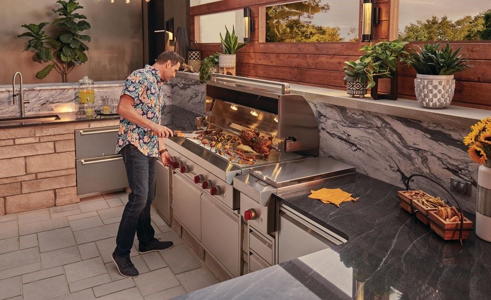 The Wolf 54" Outdoor Gas Grill (OG54) paired with Wolf 13" Classic Burner Module (BM13) for total outdoor kitchen versatility.