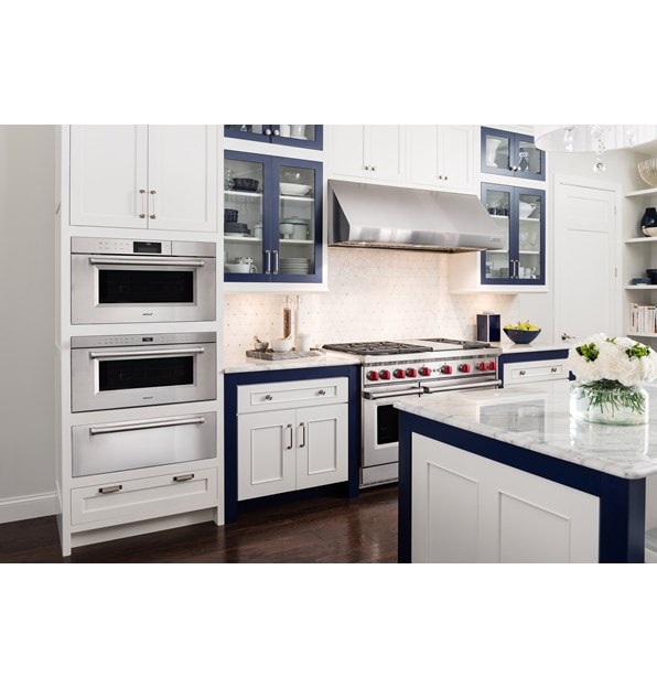 Wolf 30" M series Professional Drop-Down Door Microwave Oven (MDD30PM/S/PH) in shabby-chic kitchen with white cabinets and marble counters