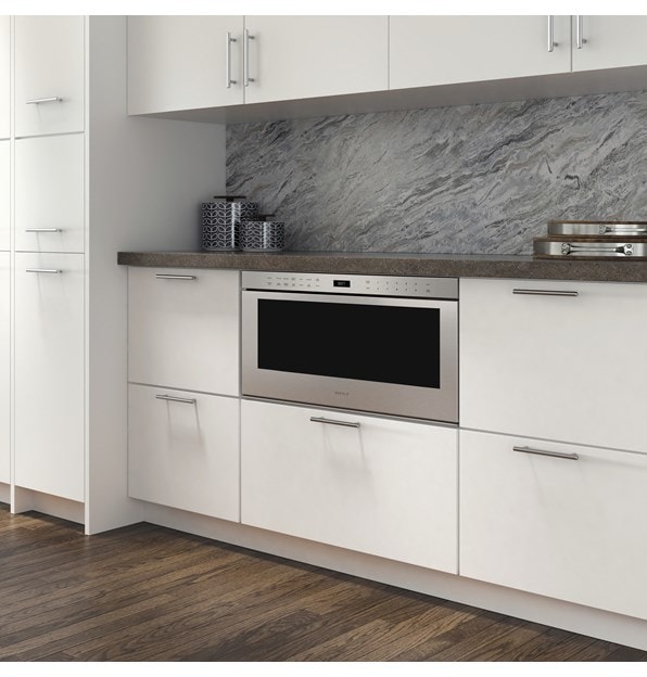 The Wolf 30" Professional Drawer Microwave Oven (MD30PE/S) shown adding ease and convenience set in classic white cabinetry 