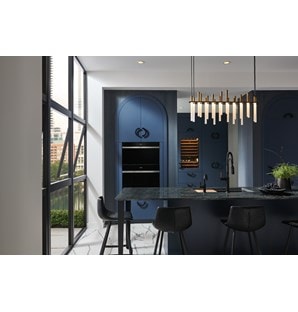 Wolf Contemporary Steam Oven (CSO3050CM) set over a Wolf Contemporary Single Oven (SO30CM) in midnight blue arched cabinets