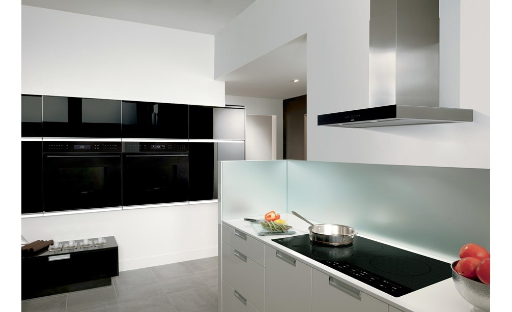 Two Wolf 30" E Series Contemporary Classic Single Oven (SO30CE/B/TH) shown installed flush with surrounding modern minimalist cabinetry