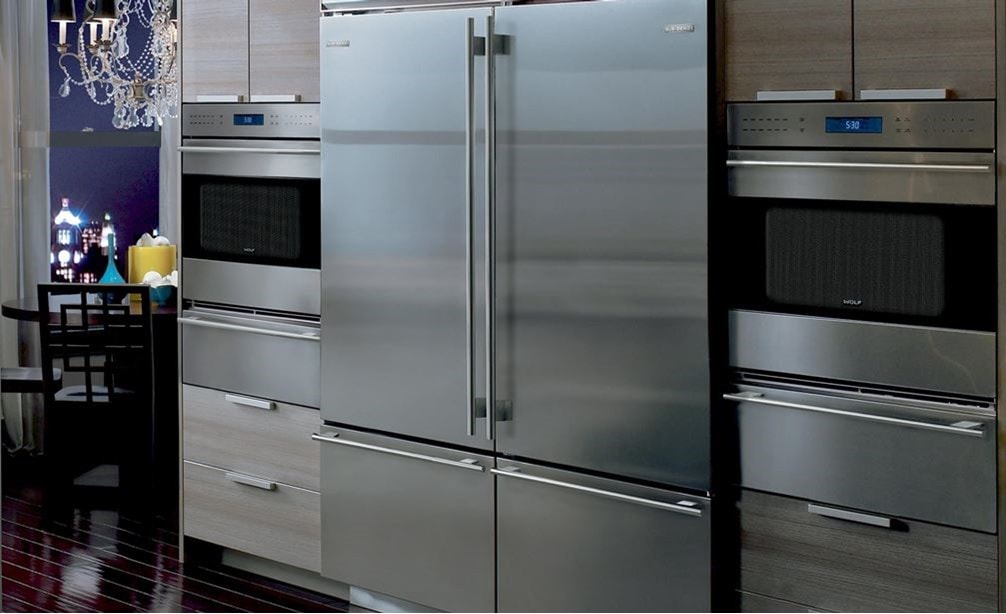 Pair of Wolf 30&quot; E Series Transitional Classic Single Ovens (SO30TE/S/TH) on each side of Sub-Zero 30&quot; Classic Over Under Refrigerator (BI-30U/S)