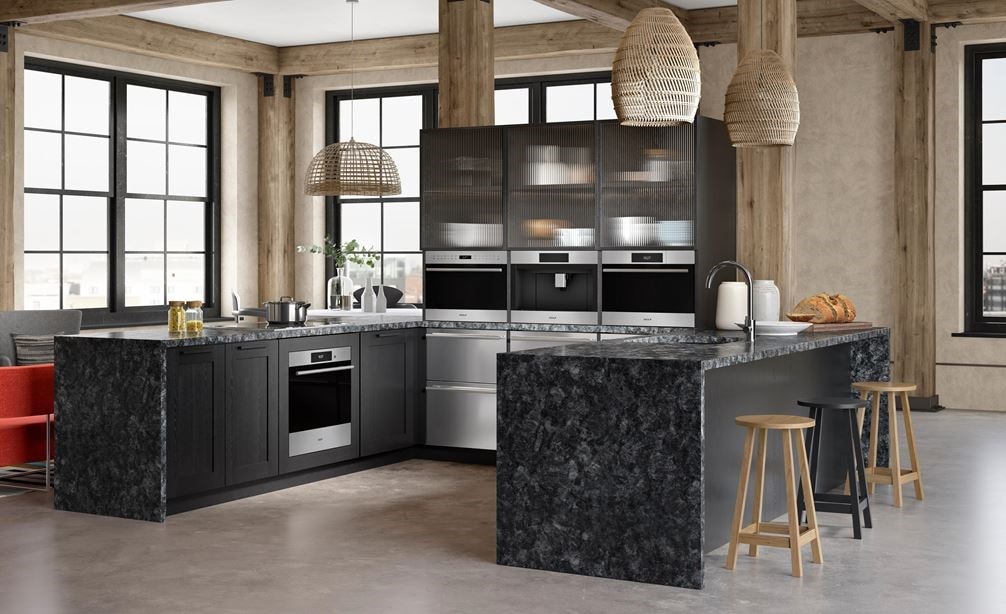 Wolf 24&quot; E Series Transitional Built-In Single Oven (SO2450TE/S/T) surrounded by custom black cabinetry in a unique wooden kitchen
