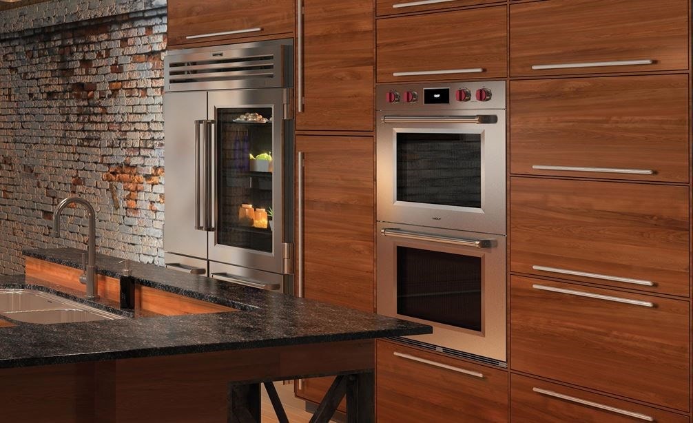 The Wolf 30&quot; M Series Professional Double Oven (DO30PM/S/PH) shown integrated into an urban industrial kitchen design style