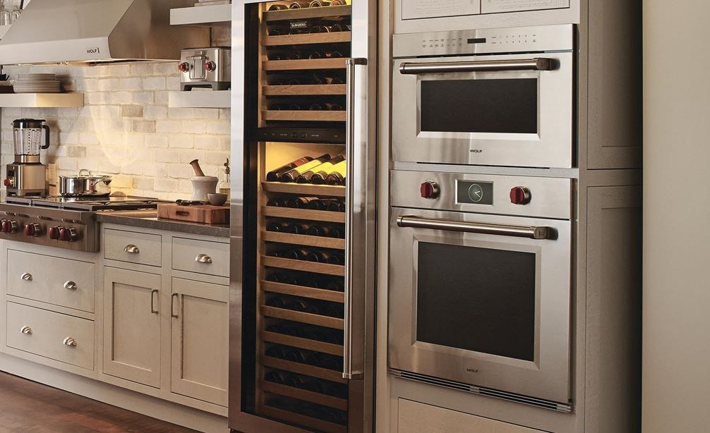Wolf 30&quot; M Series Professional Single Oven (SO30PM/S/PH) with Wolf 42" Pro Wall Hood 24&quot; Depth (PW422418) shown in rustic country kitchen
