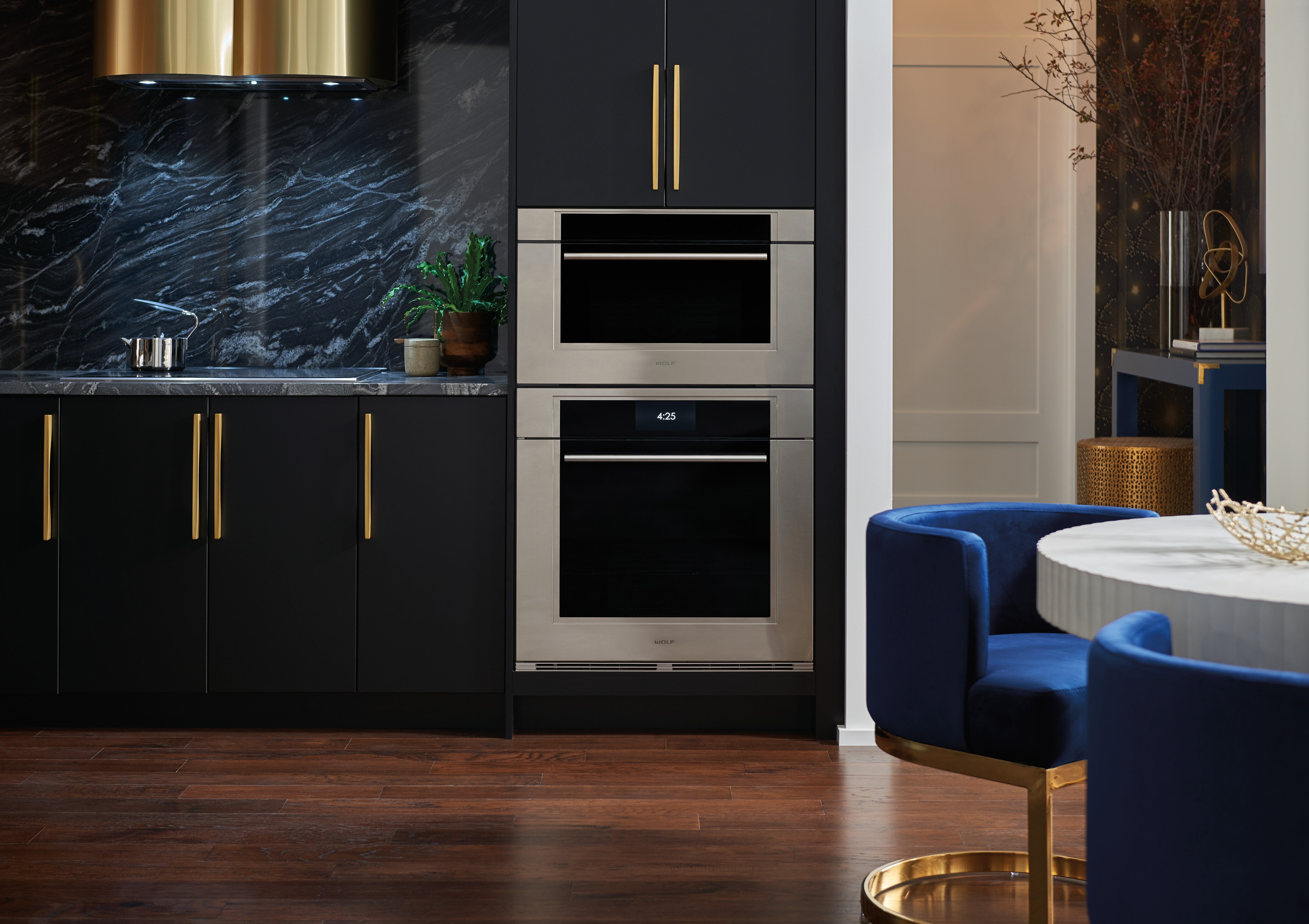 The Wolf 30" M Series Transitional Speed Oven - SPO3050TM/S/T in a modern black high rise
