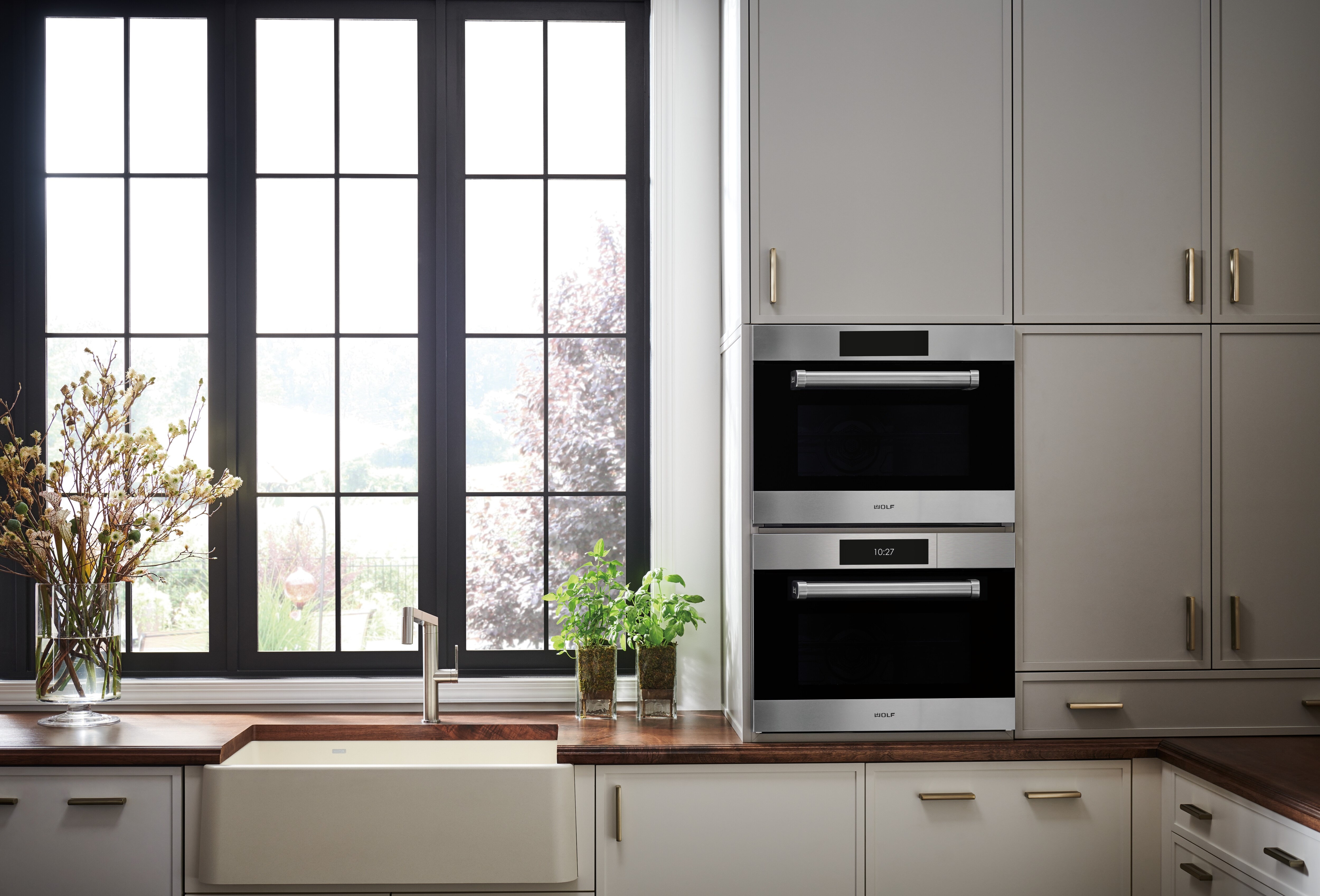 A 24 inch traditional speed oven paired with a 24 inch convection steam oven by Wolf Appliances.