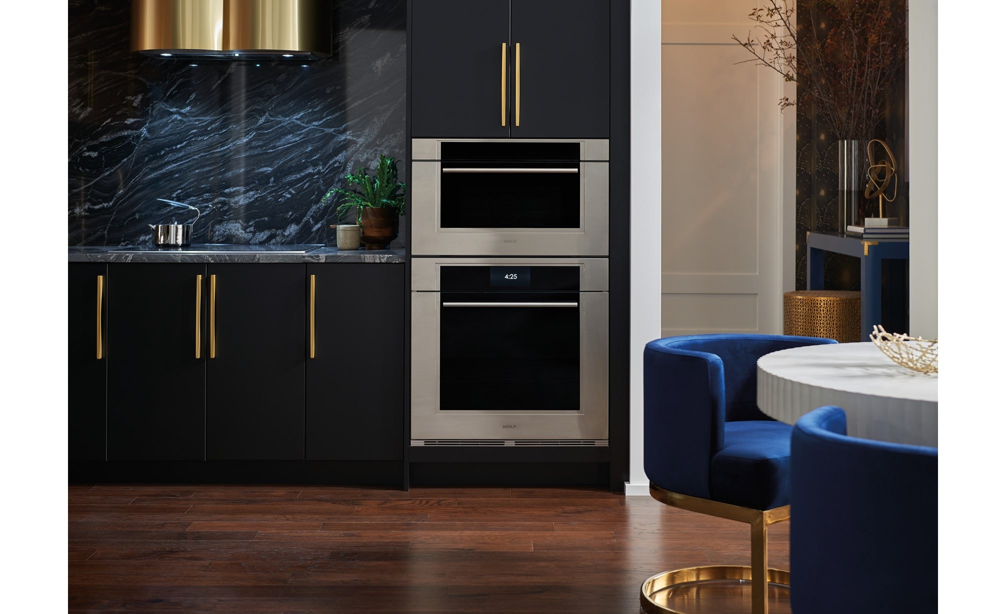 The Wolf 30" M Series Transitional Speed Oven - SPO3050TM/S/T in a modern black high rise