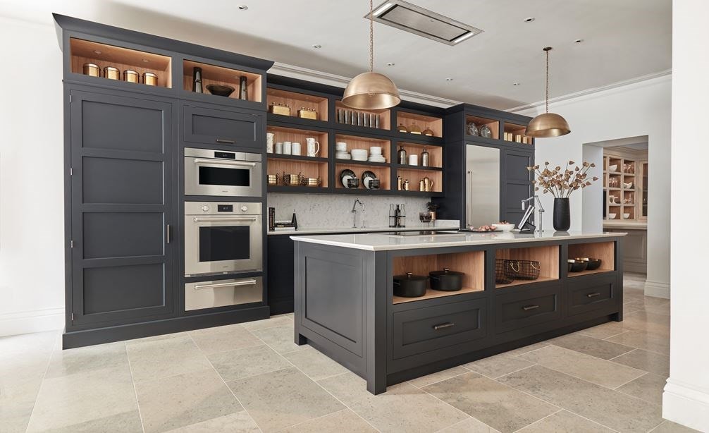 Wolf 30&quot; M Series Professional Convection Steam Oven (CSO3050PM/S/P) immersed in tall matte gray custom cabinetry in stoned tiled kitchen