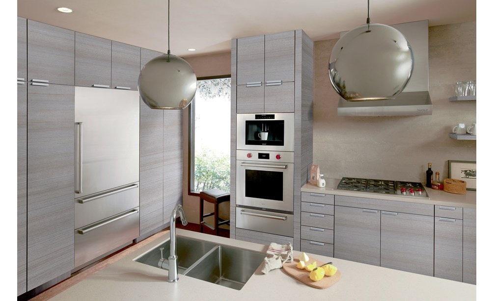 The Wolf 36" Low Profile Wall Hood (PW362210) featured in a clean modern kitchen design utilizing grey cabinetry with silver accents