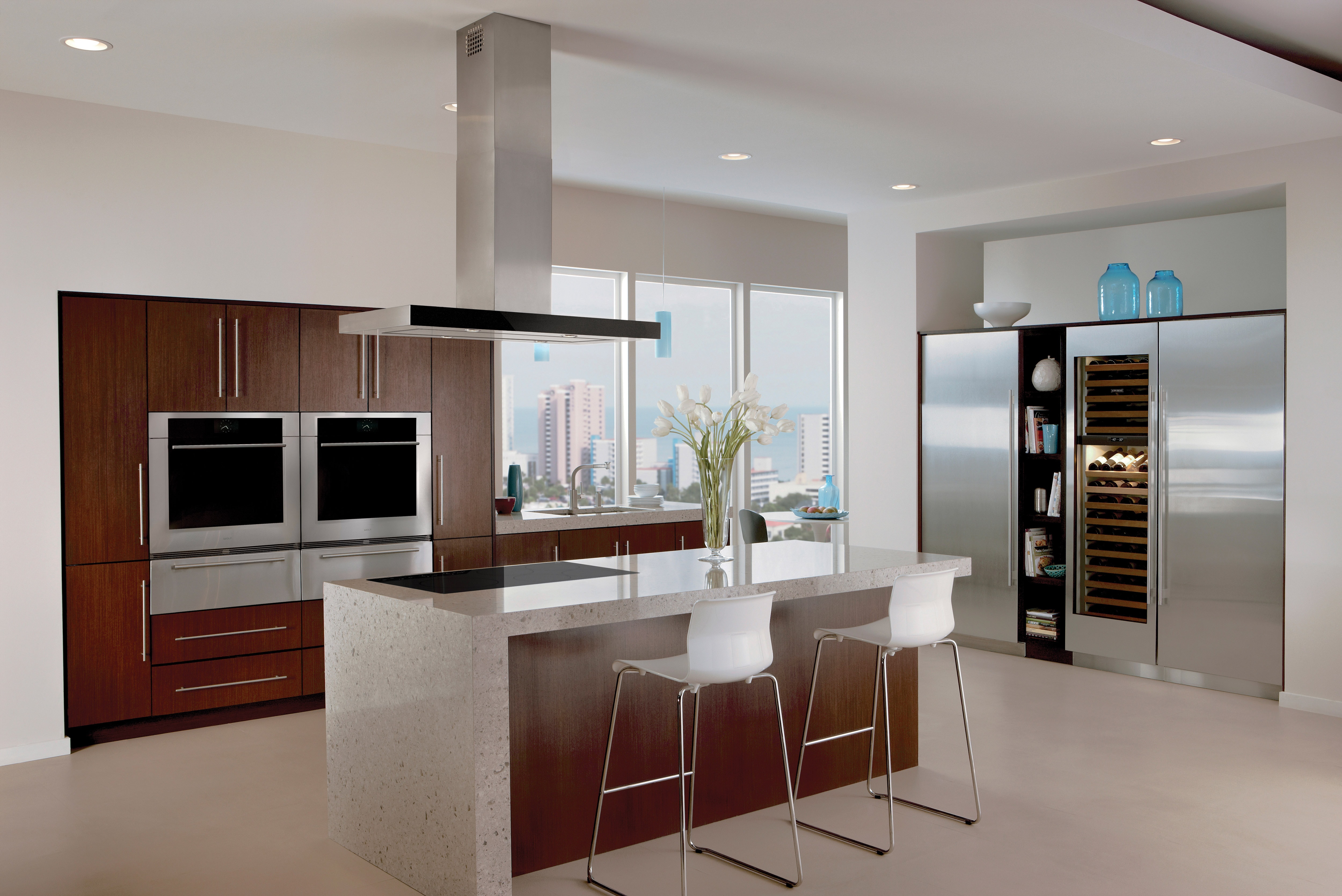 The Wolf 42" Cooktop Island Hood - Black (VI42B) displayed in modern kitchen featuring dark wood cabinetry and stainless-steel accents