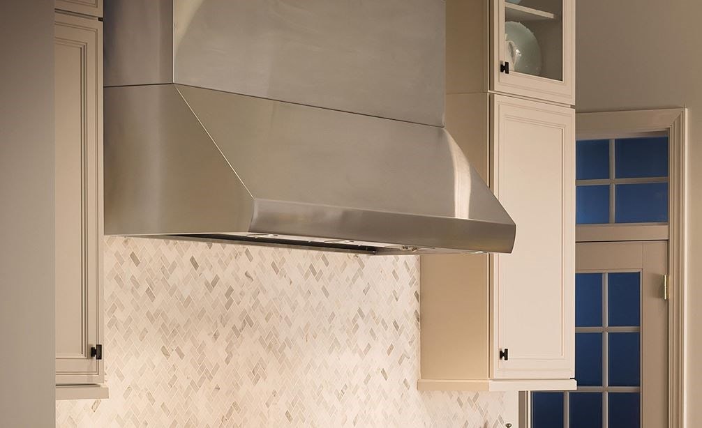 Wolf 60&quot; Pro Wall Hood 24&quot; Depth (PW602418) is a timeless beauty in this elegant French inspired kitchen using white cabinets and marble countertop