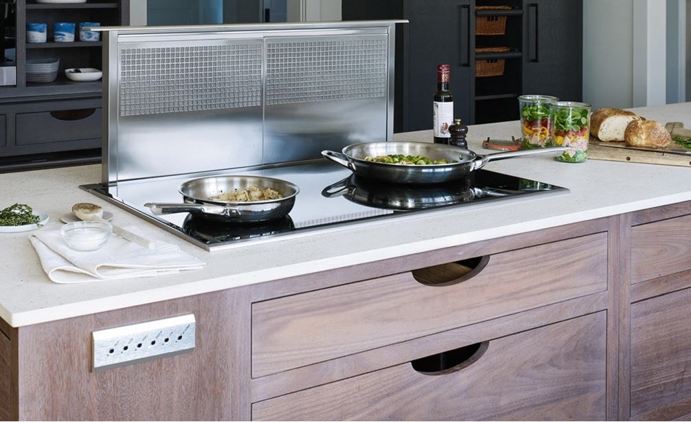 Wolf 36&quot; Downdraft Ventilation (DD36) shown with Wolf 36&quot; Transitional Induction Cooktop (CI365T/S) in natural wood finish kitchen island