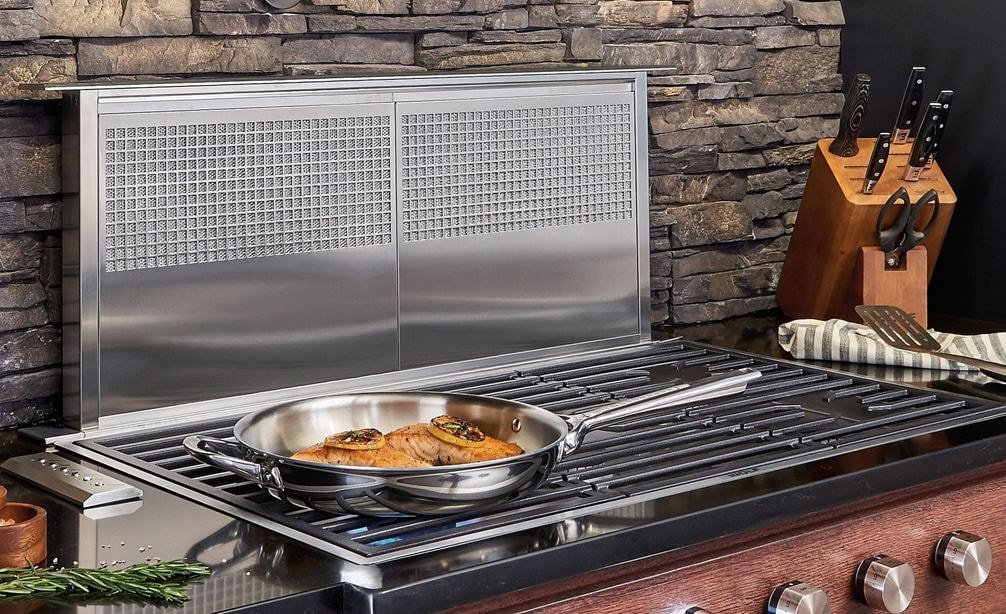 Wolf 36&quot; Downdraft Ventilation (DD36) shown with 36&quot; Contemporary Gas Cooktop 5 Burner (CG365C/S) in a kitchen design of rich textures