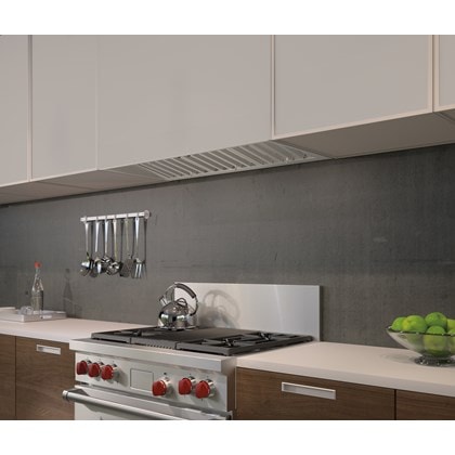 The Wolf 40" Pro Hood Liner 19" Depth (PL401912) shown blending seamlessly into smooth handleless cabinets in minimal kitchen design