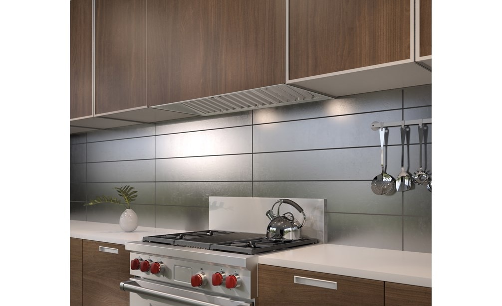 The Wolf 40" Pro Hood Liner 22" Depth (PL402212) blends expertly into sleek modern kitchen cabinetry with natural wood finish