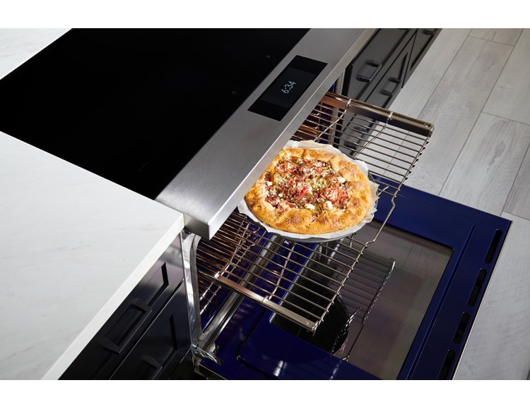 Wolf 36" Induction Range (IR36550/S/T) with Dual VertiFlow™ convection system delivers consistent multi-rack cooking as seen here with a tomato galette.