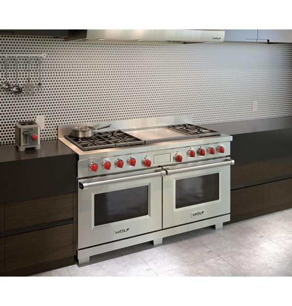 Wolf 60" Dual Fuel Range 6 Burner Infrared Dual Griddle (DF606DG) shown with modern chrome backsplash centered between glossy countertops