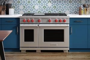Wolf Redesigned Dual Fuel Range displayed in custom granite countertops and cabinets