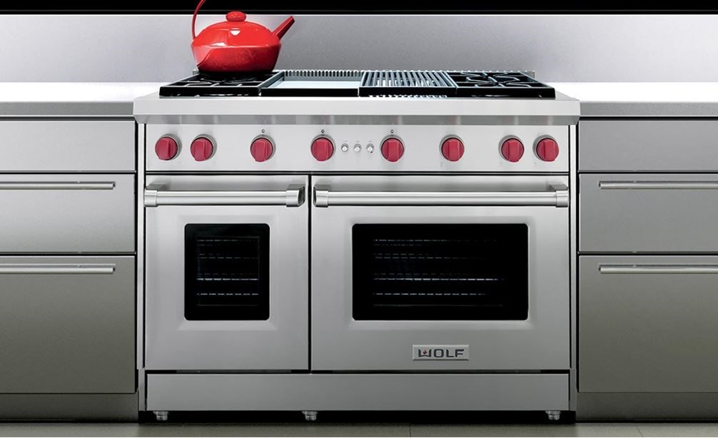 The Wolf 48&quot; Gas Range 4 Burner Infrared Charbroiler Infrared Griddle (GR484CG) shown in a contemporary modern kitchen design