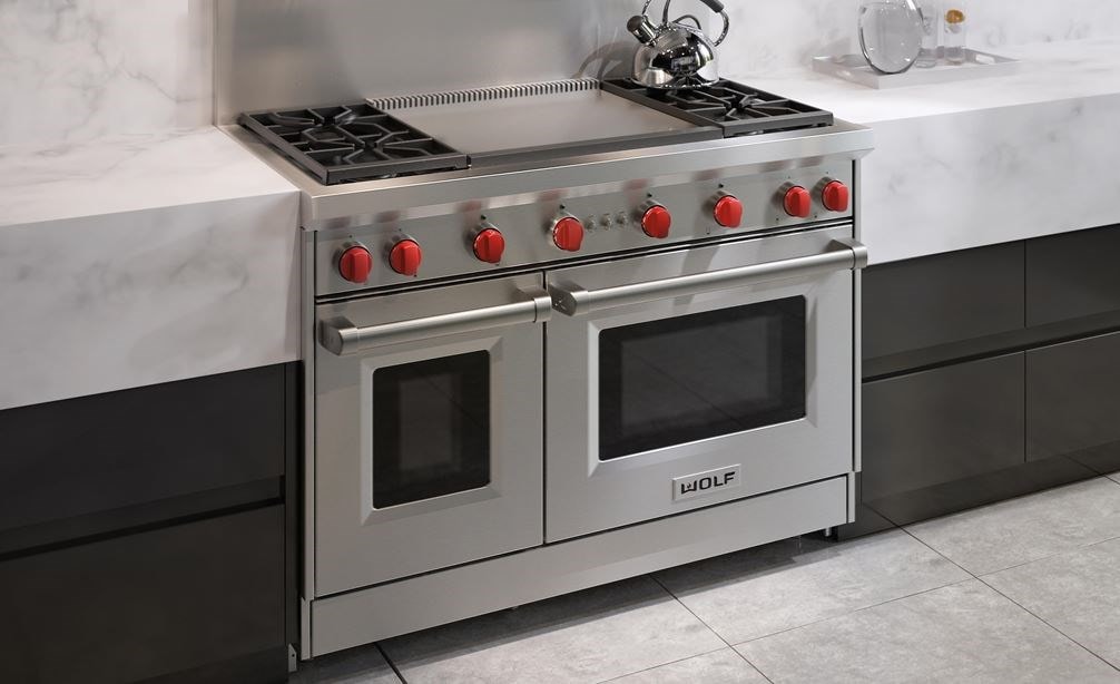 The Wolf 48&quot; Gas Range 4 Burner Infrared Dual Griddle (GR484DG) Rangetop featured in a clean modern minimalist kitchen design