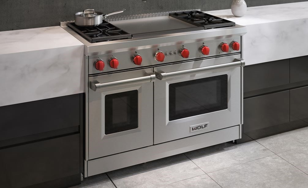 The Wolf 48&quot; Gas Range 4 Burner Infrared Dual Griddle (GR484DG) Rangetop featured in a natural urban kitchen design